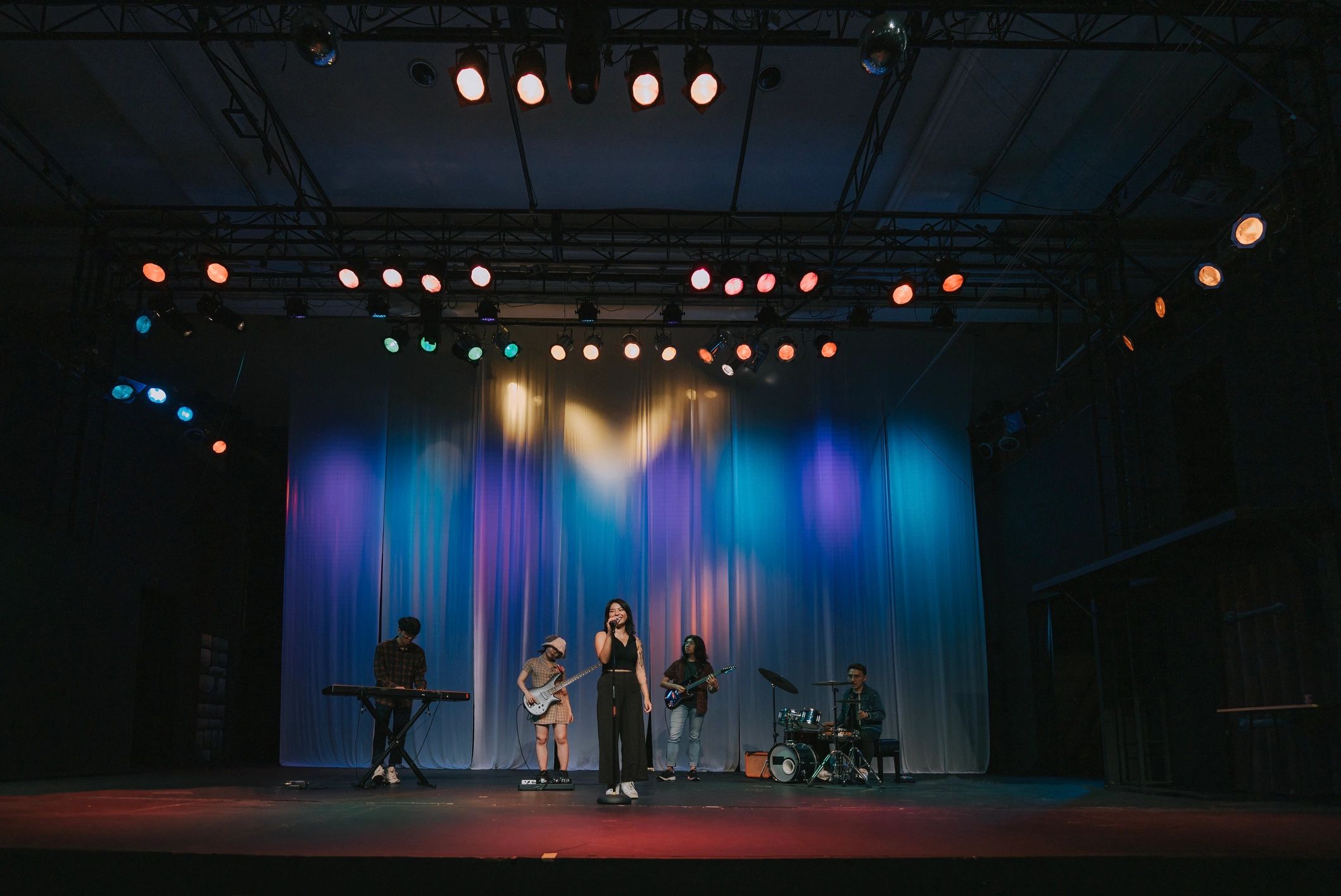 Lead singer performing with a live band