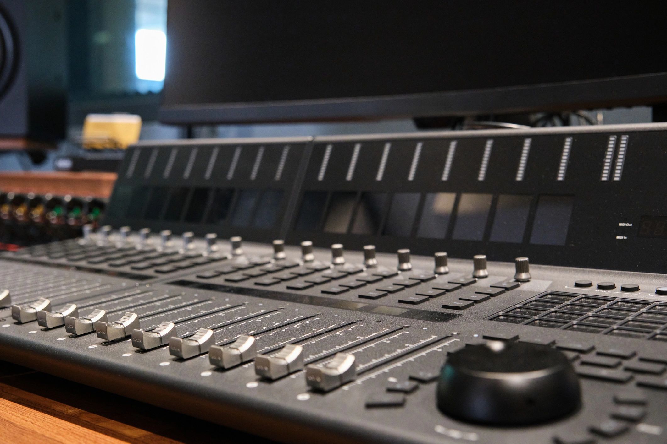 Close-up of professional sound mixer with sliders