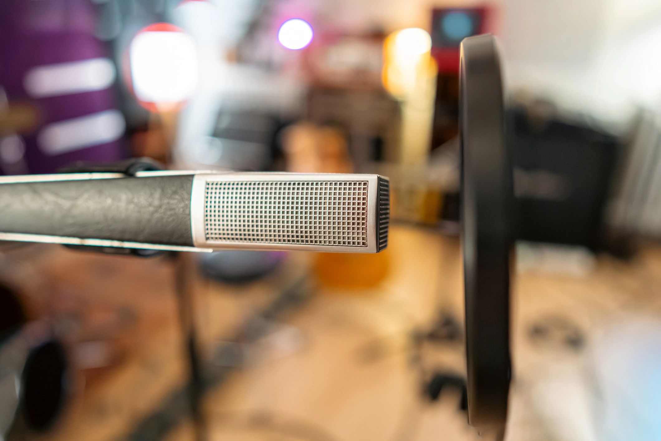 Studio microphone with pop filter in a vocal booth