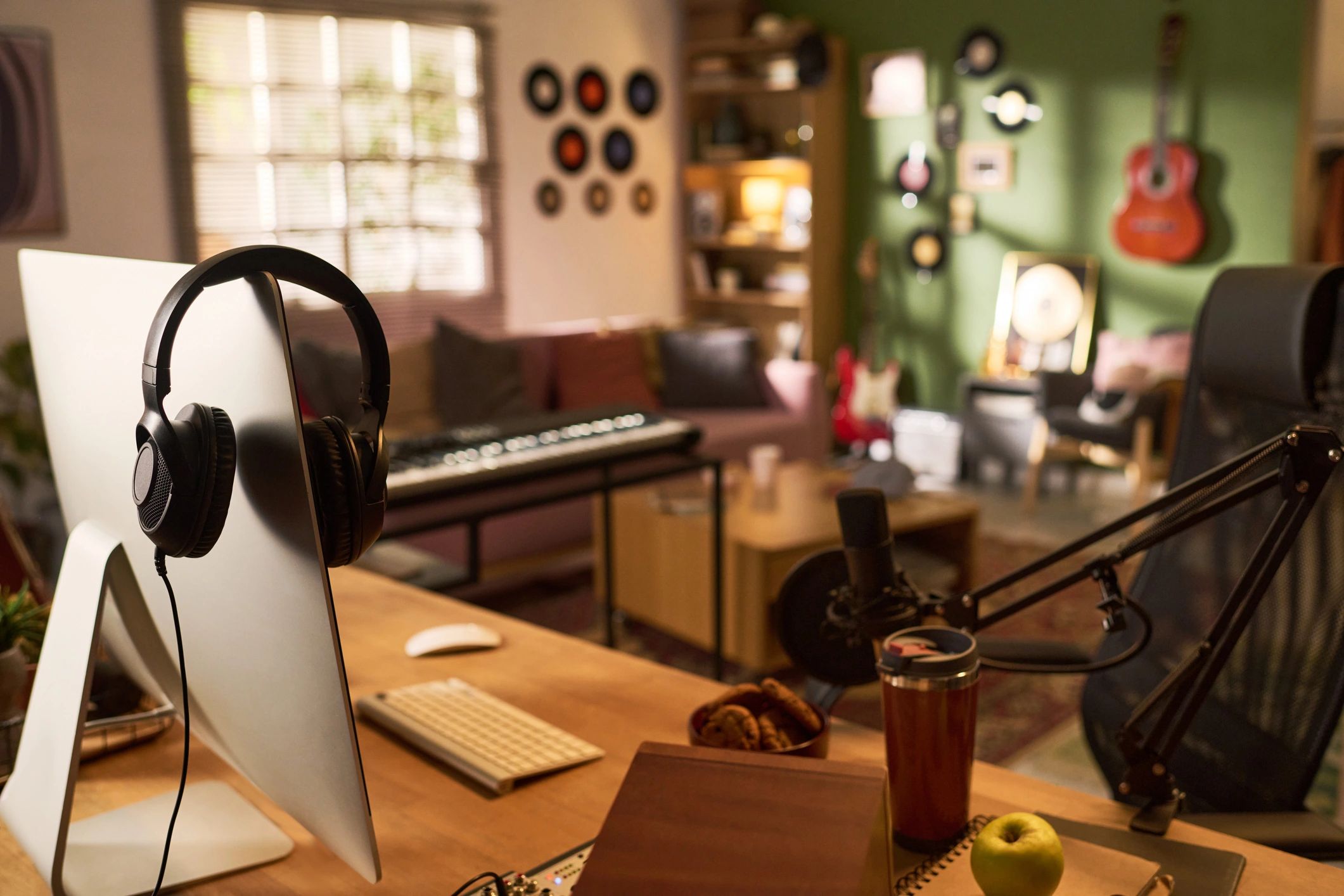 Home studio workspace with recording gear and headphones